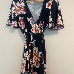 Floral Print Romper with waist tie (shorts). Size Medium